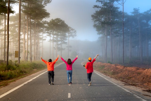People walking down a road.